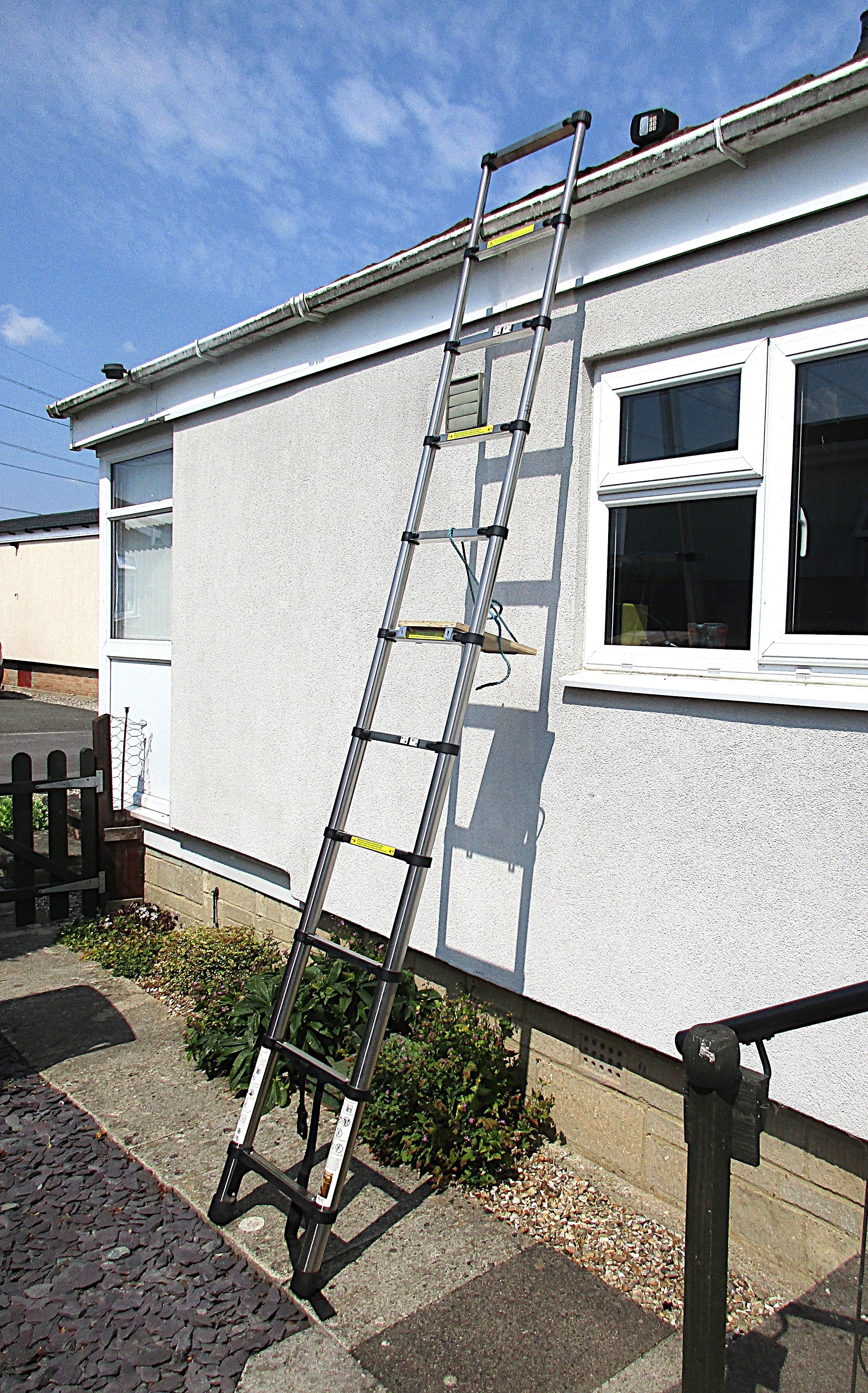 Ladder reaching the roof.